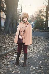 Avanti marsc’ | A brown cape and a furry hat