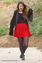 Red skirt with military jacket. 