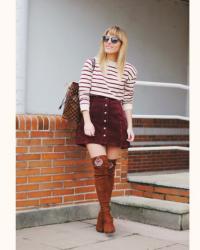 Burgundy skirt.