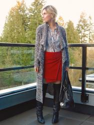 Diving in: red suede envelope skirt, snake-print blouse, and boots with over-the-knee socks