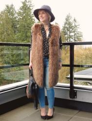 Obsession: skinny jeans, black-patterned shirt, faux-fur vest, and floppy hat