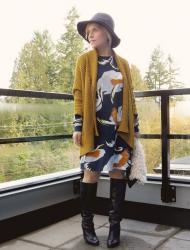 Sparks:  printed dress, drapey cardigan, knee boots, and floppy hat