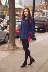 Plaid coat and red backpack 