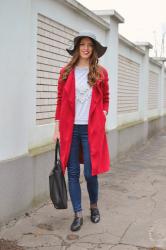 grey hat with red coat