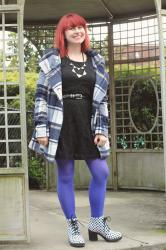 Outfit: Plaid Winter Coat, Black Lace Dress, Bright Blue Tights, and White Polka Dot Boots