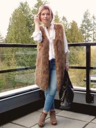 Balcony seat: white shirt, skinny jeans, long faux-fur vest, and open-toe booties