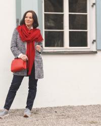 Add a red statement piece to a classic look