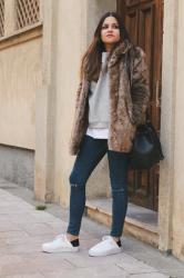 fur coat, jeans & sneakers