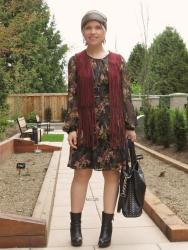 Inside out:  floral dress, fringy vest, platform booties, and leather beanie