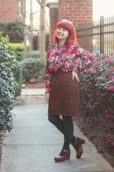 Work Outfit: Digital Floral Blouse, Brown Suede Skirt, Green Tights, and Clogs
