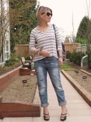 Thirds:  boyfriend jeans, striped henley, strappy heels, and cat-eye sunglasses