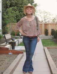 Western flare:  Paisley blouse, flare jeans, and cowboy hat