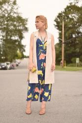 Flower show:  floral-print jumpsuit, sleeveless coat, and strappy nude sandals
