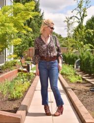 Concrete jungle:  cropped flare jeans, peasant blouse, corset belt, and lace-up heels