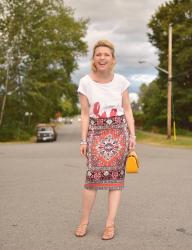Seeing red:  lobster t-shirt, patterned pencil skirt, strappy sandals, and patent yellow bag