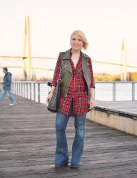 Open season:  styling a red plaid tunic with flare jeans and an olive moto vest