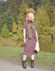 Pattern play:  pencil skirt, floral blouse, moto vest, and platform booties