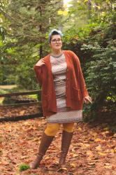 Cable knit sweater, vintage dress, and knee high boots