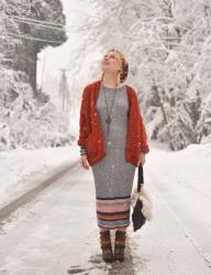 Good tidings: styling a striped sweater dress with a chunky cardigan, booties, and a floral beanie