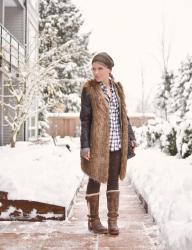 Whitewash:  styling a plaid shirt and leggings with a faux-fur vest and leather beanie