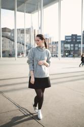 Silver ankle boots, black coat and oversized sweater