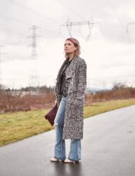 Out of season:  styling distressed flare jeans with a Chanel-style jacket and long cardigan