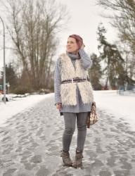 White elephant:  styling an oversized sweater with a belted furry vest and skinny jeans 
