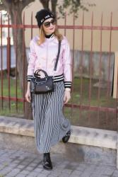 Striped maxi dress and metallic pink bomber jacket