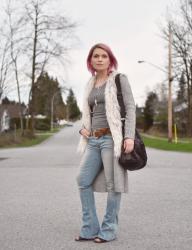 Determination:  Styling a tank top and flare jeans with a long cardi and faux-fur vest