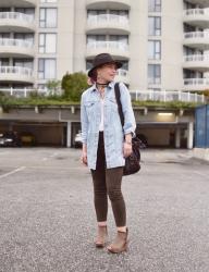 Topsy turvy:  styling vegan suede leggings, an oversized denim jacket, open-toe wedge booties, and a fedora