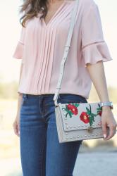 Dressed up jeans with blush tones