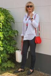 Eijk flat shoes and a red mini bag