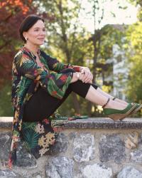 Wearing a sheer, floral tunic on a warm summer evening