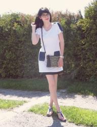 223. white tunic and black skirt