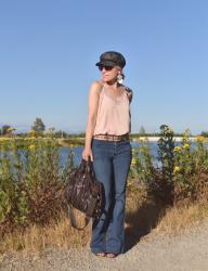 Happiness:  flare jeans, lingerie-inspired camisole, and a baker boy cap