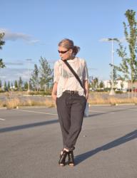 Shop girl: styling a sheer lace top with slouchy trousers, cut-out booties, and a crossbody bag