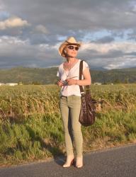Farm fresh:  green striped skinny jeans, slouchy tee, ivory booties, and a cowboy hat
