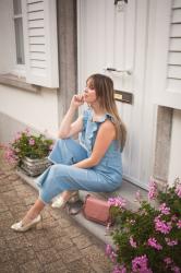 Outfit: ruffled jumpsuit, gold loafer pumps