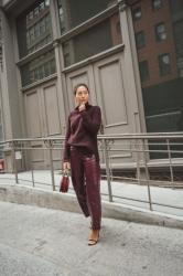 Monochrome burgundy vinyl pants and sweater