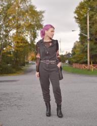 Jumpstart: Styling a sleeveless jumpsuit with a sheer floral top, statement belt, and platform booties
