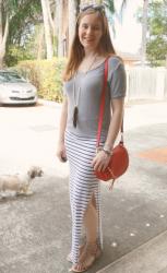 Grey Tees and Printed Maxi Skirts With A Red Rebecca Minkoff Saddle Bag
