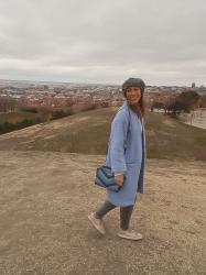 Blue coat and grey sky