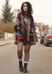 Outfit: She smiles like a child with flowers in her hair.