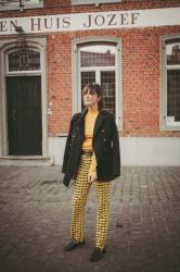 Outfit: yellow plaid trousers, military coat and loafers