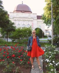 Lady in Red in a Field of Roses