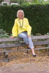 Bright yellow top with bell sleeves