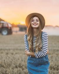 Denim dress with braces and striped blouse