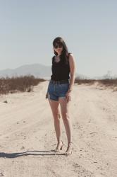 black tank and denim shorts