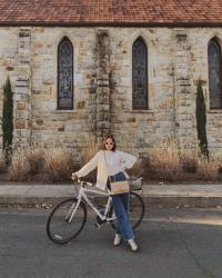 White Faux Fur Coat, Jeans, and Snakeskin Boots