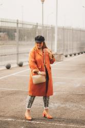 Orange trench; with Moda Florencia.